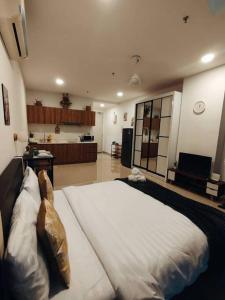a bedroom with a large bed in a room at Cozy Haven Perfect Studio Getaway in Petaling Jaya +8 photos