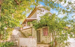 a house with stairs leading up to it at Three-Bedroom Holiday Home In Santagata Feltria Rn in SantʼAgata Feltria