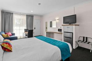 Postel nebo postele na pokoji v ubytování Econo Lodge Border Gateway Wodonga