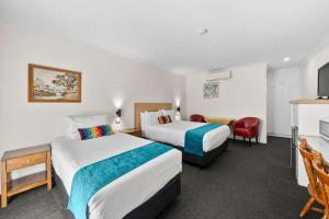 Postel nebo postele na pokoji v ubytování Econo Lodge Border Gateway Wodonga