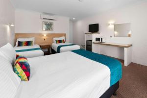 Postel nebo postele na pokoji v ubytování Econo Lodge Border Gateway Wodonga