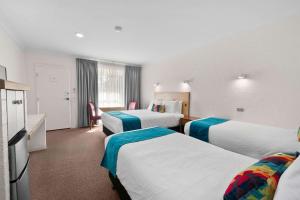 Postel nebo postele na pokoji v ubytování Econo Lodge Border Gateway Wodonga