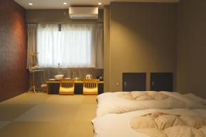 Postel nebo postele na pokoji v ubytování KIMIEN Hotel