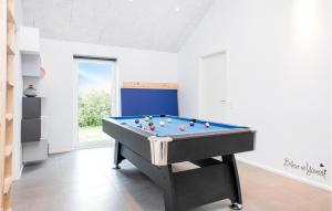 a room with a pool table with balls on it at Gorgeous Home In Løkken With Sauna in Løkken