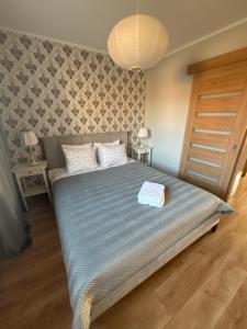 Posteľ alebo postele v izbe v ubytovaní Apartament Centrum