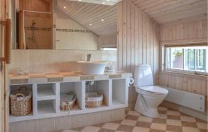 a bathroom with a sink and a toilet at Holiday Home Ørnevej Sjællands Odde Denm in Yderby