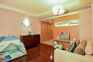 Voodi või voodid majutusasutuse Shenzhen Dameisha Kingkey Palace Hotel toas