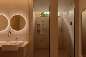 a bathroom with a sink and a shower at KINN Habitat in Singapore +21 photos