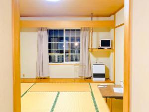 TV a/nebo společenská místnost v ubytování SnowHouse Memorie Hotel-汤泽石打丸山
