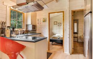 a kitchen with a sink and a stove in a room at Two-Bedroom Holiday Home In Herning in Herning