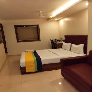 Postel nebo postele na pokoji v ubytování Hotel Elegant - Mohammed Ali Road