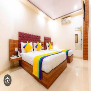 Postel nebo postele na pokoji v ubytování Hotel Elegant - Mohammed Ali Road