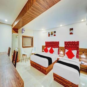 Postel nebo postele na pokoji v ubytování Hotel Elegant - Mohammed Ali Road