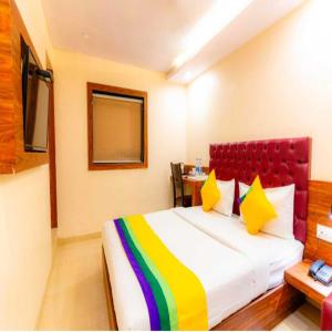 Postel nebo postele na pokoji v ubytování Hotel Elegant - Mohammed Ali Road