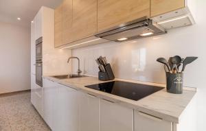 a kitchen with a sink and a counter top at Stunning Apartment In Almuñecar in Almuñécar +10 photos