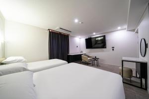 Seosan Hotel Posto客房内的一张或多张床位