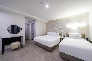 Seosan Hotel Posto客房内的一张或多张床位