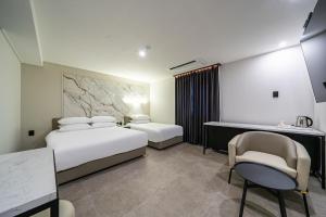 Seosan Hotel Posto客房内的一张或多张床位