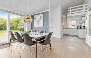 a dining room with a table and chairs at 3 Bedroom Beautiful Home In Nexø in Neksø