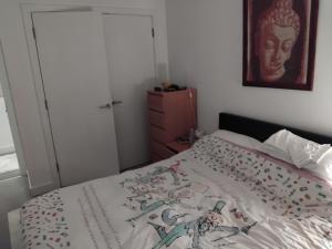 a bedroom with a bed with a blanket on it at Tower Bridge - Saint Katherine's Dock in London