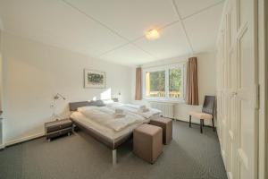 Postel nebo postele na pokoji v ubytování Sans Souci EG by Arosa Stay + 28 fotografií