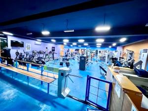 a gym with a bunch of exercise bikes in it at Spacious Condo Unit with Balcony in Lo-oc +10 photos