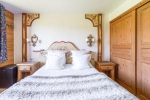 Postel nebo postele na pokoji v ubytování La Maison Hôtel Les Peupliers