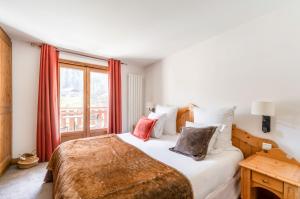 Postel nebo postele na pokoji v ubytování La Maison Hôtel Les Peupliers