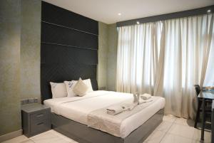 Postel nebo postele na pokoji v ubytování NT Hotels and Resorts Akridha