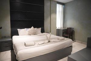 Postel nebo postele na pokoji v ubytování NT Hotels and Resorts Akridha