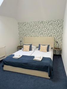 Postel nebo postele na pokoji v ubytování Hotel Apollon