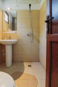 a bathroom with a shower and a sink at AlmaVille Mamaia in Mamaia Sat/Năvodari +124 photos