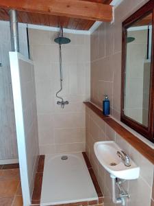 a bathroom with a sink and a toilet and a mirror at El Escondite Perfecto in Benacazón +10 photos