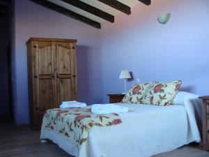 Postel nebo postele na pokoji v ubytování Casas Rurales Manolo