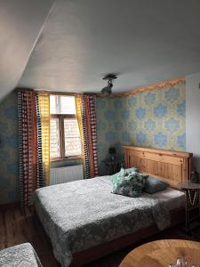 Postel nebo postele na pokoji v ubytování Fontaine Valhalla Hotel