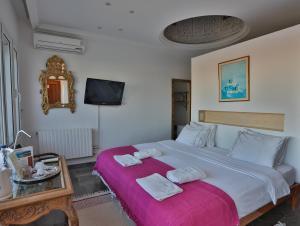 Cama ou camas em um quarto em Dar Souad