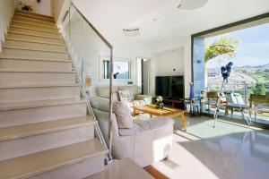 a living room with stairs leading to a living room at Holiday Home Villa Gema in Maspalomas