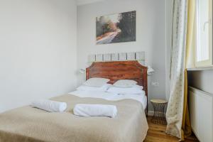 Posteľ alebo postele v izbe v ubytovaní ShortStayPoland Plac Mirowski