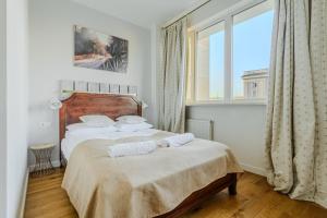 Posteľ alebo postele v izbe v ubytovaní ShortStayPoland Plac Mirowski