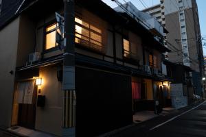 a building with lights on the side of a street at JPRESERVE Yanagi in Nishinotōindōri