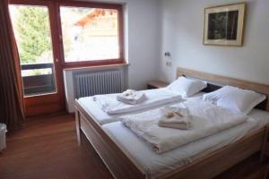 Ένα ή περισσότερα κρεβάτια σε δωμάτιο στο Chalet Alber