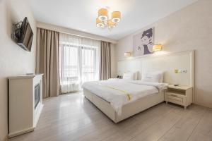 Katil atau katil-katil dalam bilik di Helios Hotel & SPA +38 gambar