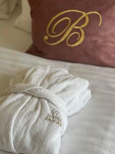 Ένα ή περισσότερα κρεβάτια σε δωμάτιο στο Hotel Bajkal