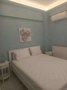 Ένα ή περισσότερα κρεβάτια σε δωμάτιο στο Elegant Luxury Suite