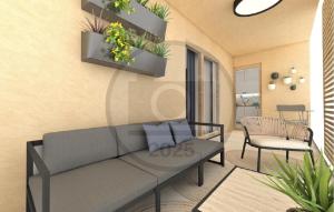 una sala de estar con un sofá y una silla en Nice Apartment In Starigrad Paklenica, en Starigrad-Paklenica