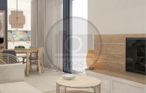 Una sala de estar con una mesa y un televisor. en Nice Apartment In Starigrad Paklenica, en Starigrad-Paklenica