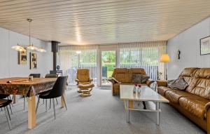 a living room with a couch and a table at Gorgeous Home In Hemmet With Wifi in Hemmet