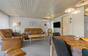 a living room with a couch and a table at Gorgeous Home In Hemmet With Wifi in Hemmet
