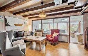 a living room with a couch and chairs and a table at 4 Bedroom Stunning Home In Humble in Humble