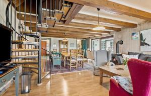 a kitchen and living room with a spiral staircase at 4 Bedroom Stunning Home In Humble in Humble